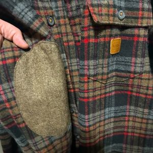 Roark Revival button down flannel with sleeve patches.